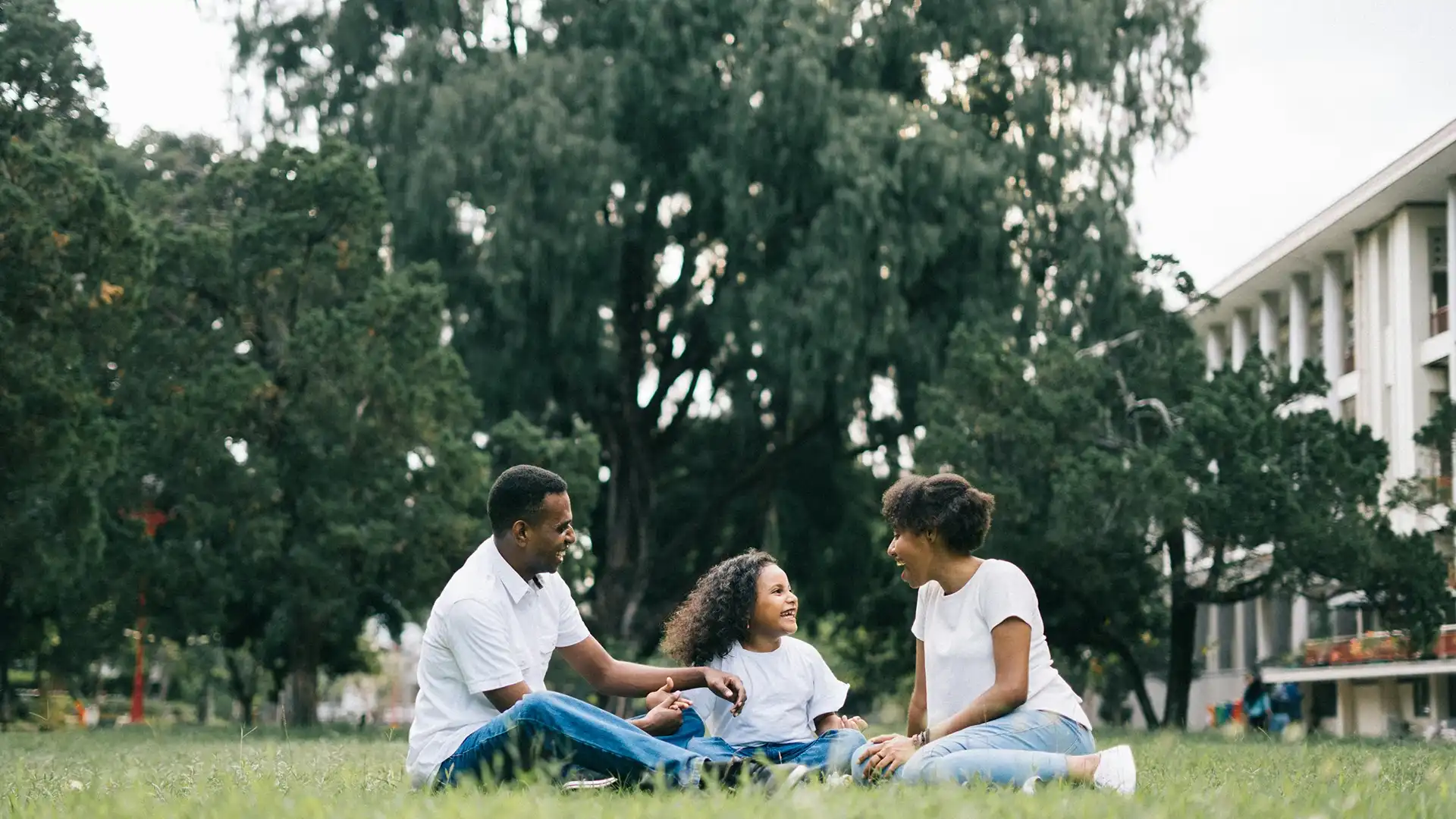 Family embracing outdoors